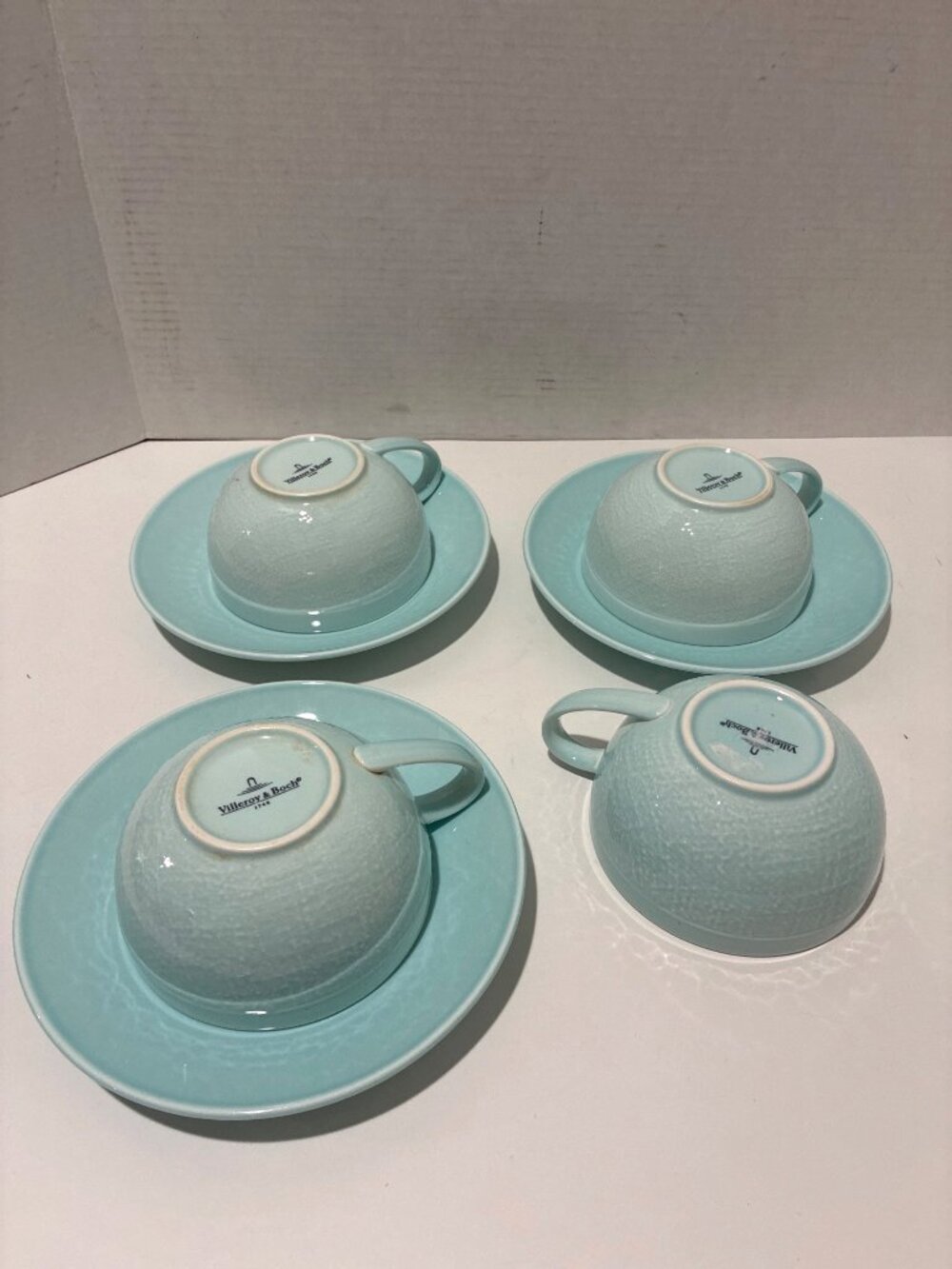 Villeroy & Boch 1748 teacups and saucers featuring a light blue crackle glaze fi